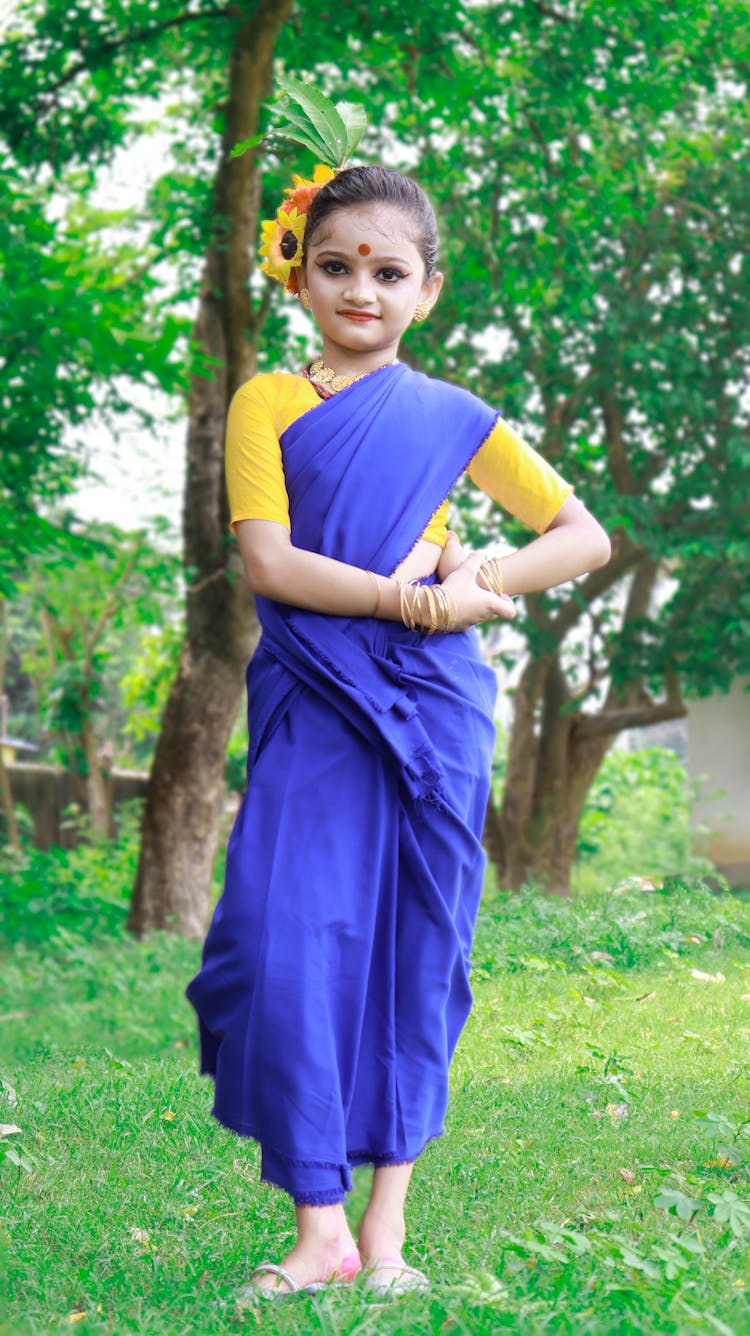 Girl In Traditional Clothes In Garden