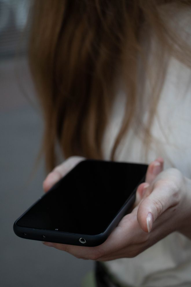 Close-up of hands holding a phone outdoors — photo by Art_Photo_Fil on Pexels