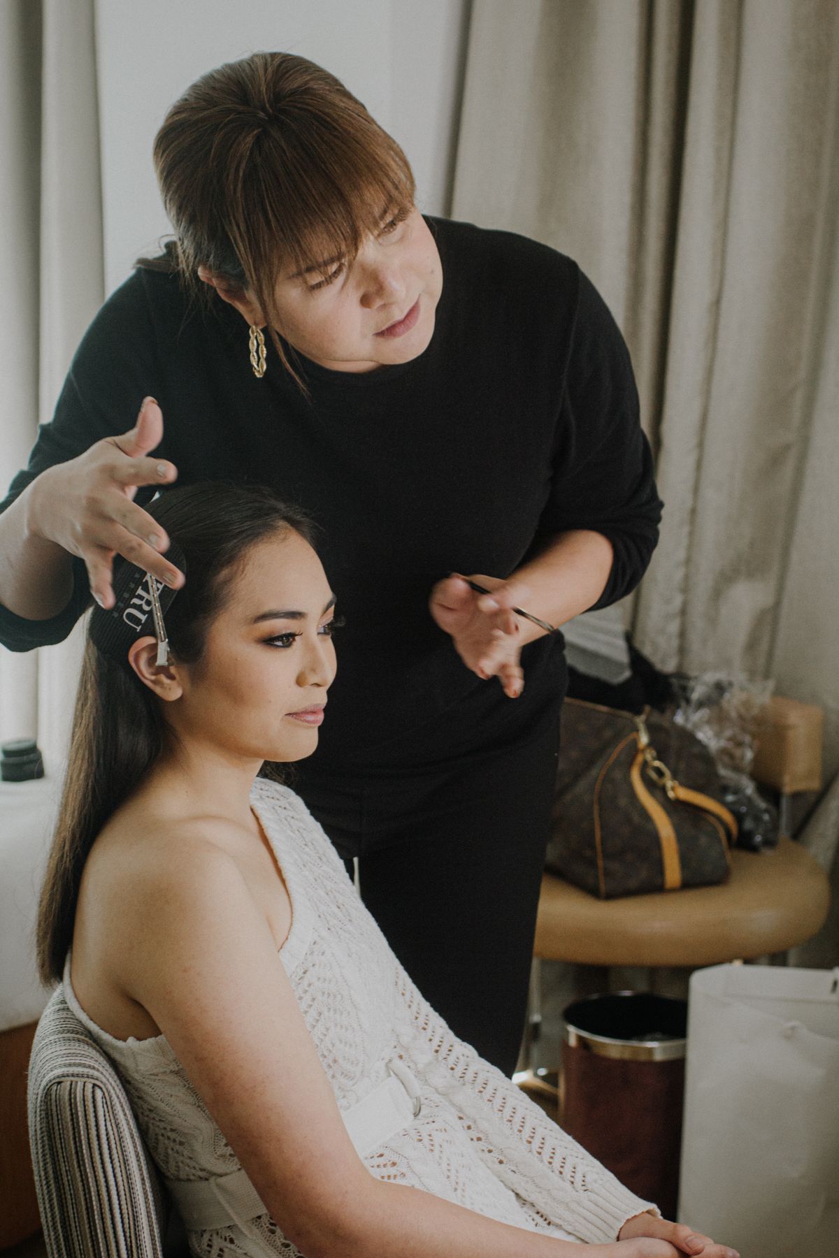Makeup artist preparing a client for a special event