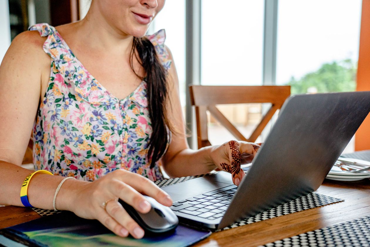 Woman working remotely on a laptop indoors