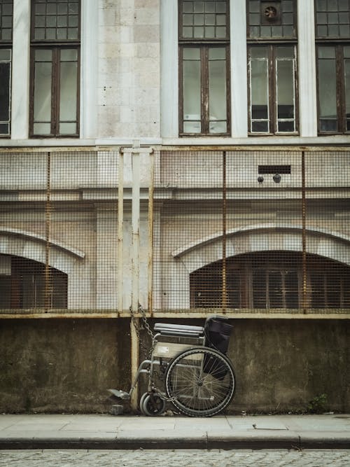 Free Black Bicycle Parked Beside White Concrete Building Stock Photo