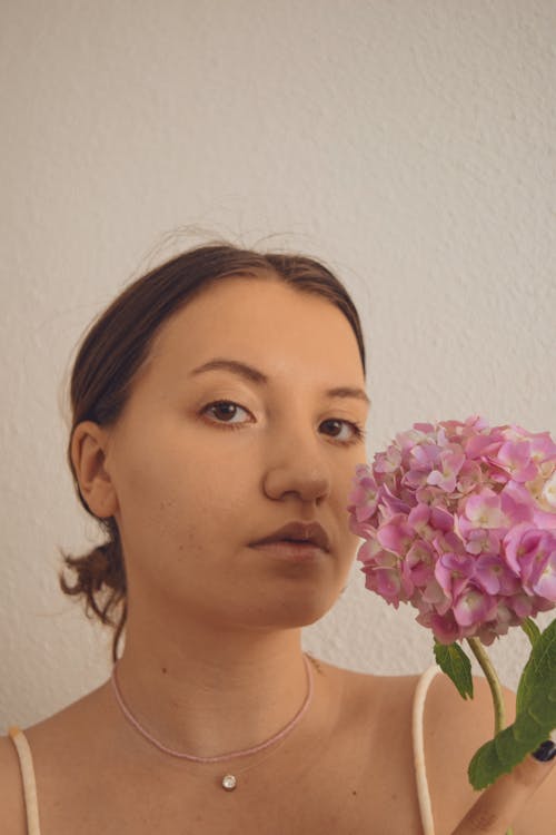 Pink Flowers Near Woman's Face