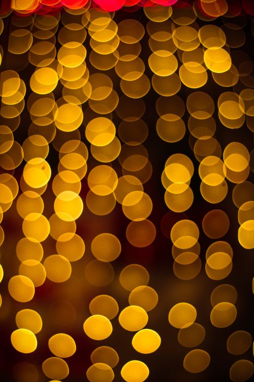 Free Abstract image of golden bokeh circles creating a warm, festive atmosphere. Stock Photo