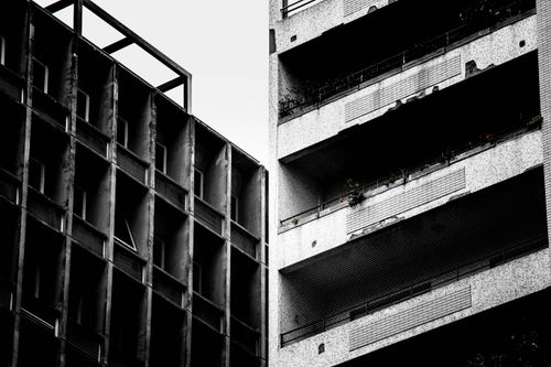 Free Black and white photograph of contrasting old and modern building exteriors. Stock Photo
