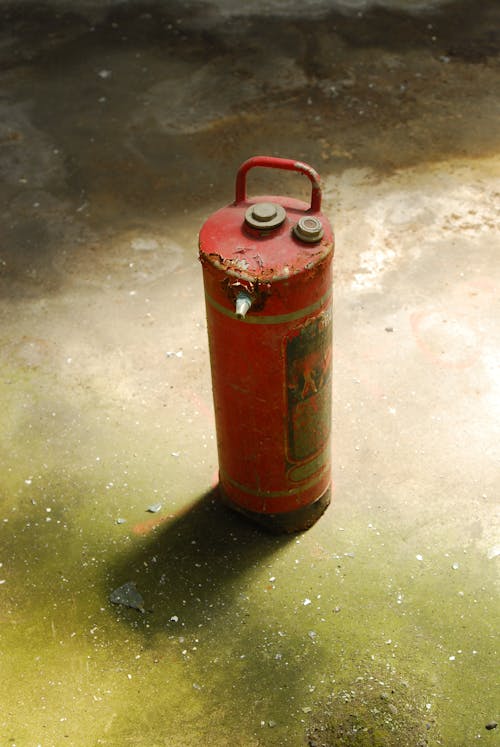 Free Red Fire Extinguisher on the Floor Stock Photo