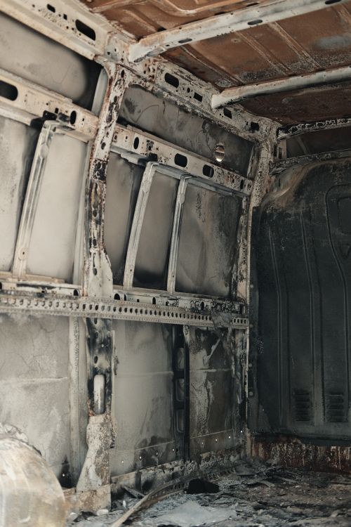 Free Detailed shot of a rusty, abandoned van interior showing decay. Stock Photo