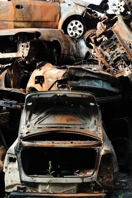 Free Pile of Rusty Abandoned Cars Stock Photo