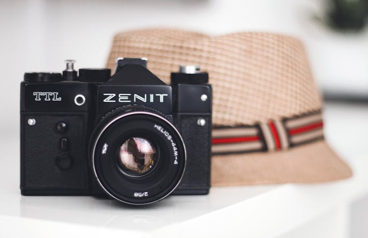 Zenit Brand Camera Beside Fedora Hat