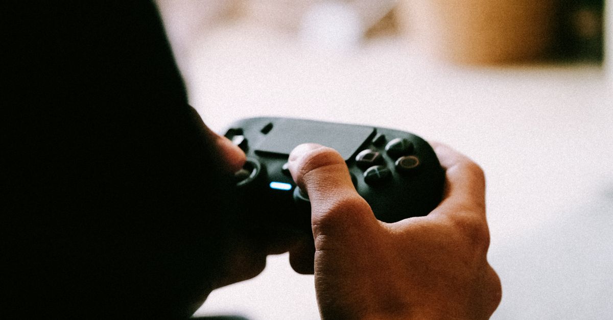 Person Using Game Controller A Person Using Gaming Controller · Free Stock Photo