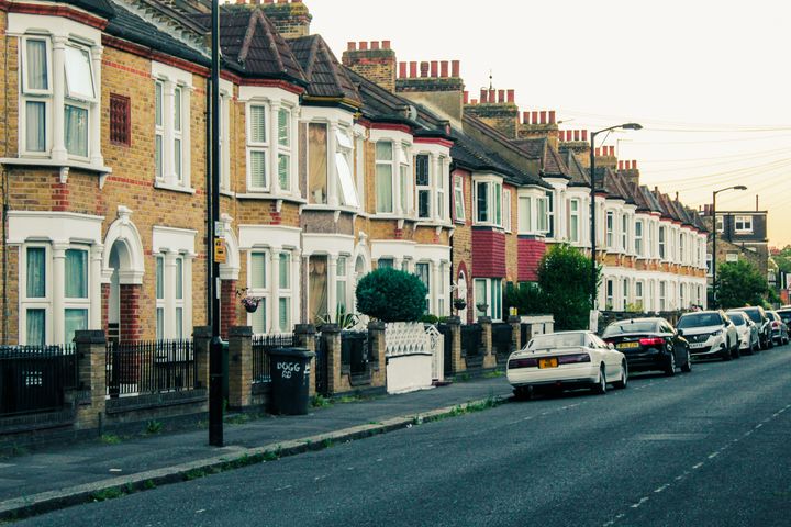 Row of terraced houses on a London street at dusk