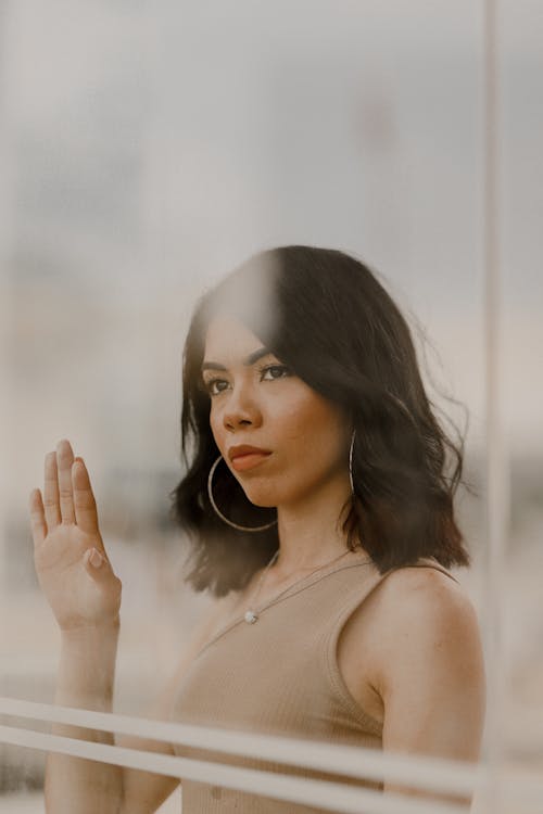 Portrait of Woman with Raised Hand