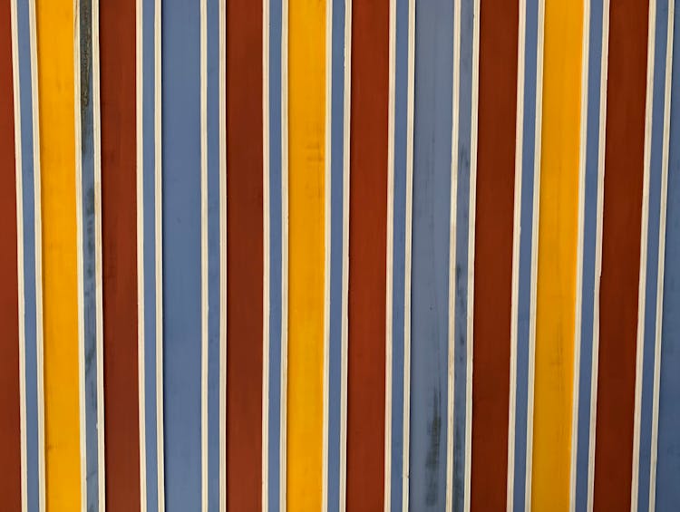 A Wall Painted In Stripes Of Different Colors