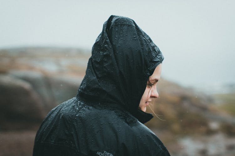 A Woman Wearing A Rain Jacket