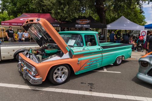 Free A custom vintage Chevrolet pick-up with an open hood showcased at a car event in Modesto. Stock Photo