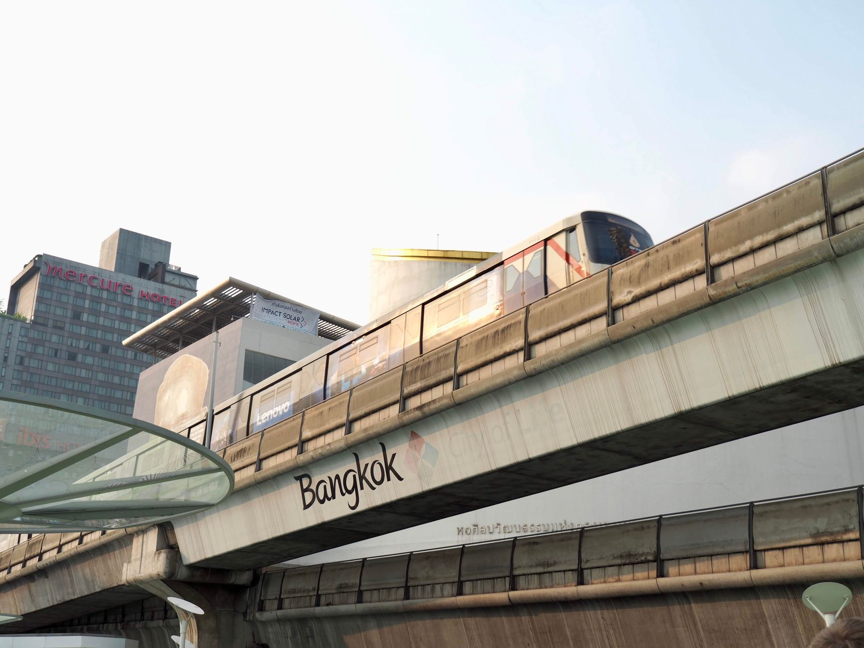 Weekend market stalls and elevated MRT tracks in Chatuchak, northern Bangkok