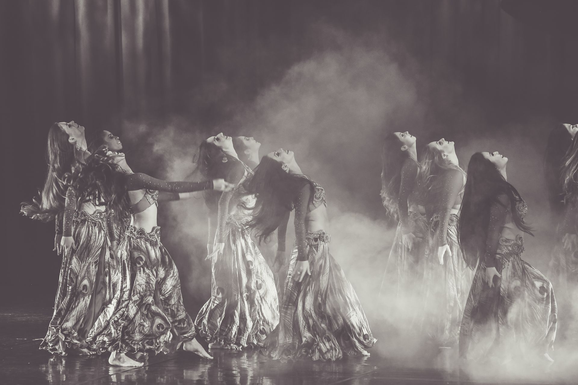 Monochrome Photography of Women Performing On Stage
