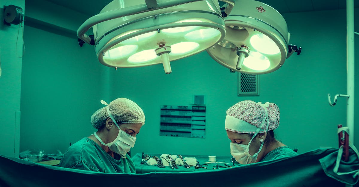 Two Person Doing Surgery Inside Room