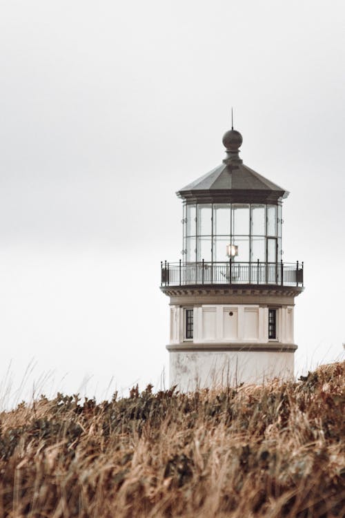 Free Concrete Lighthouse With Glass Panels Stock Photo