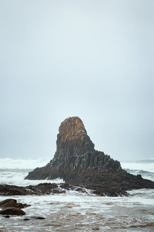 Brown Rock Formation on Sea Water