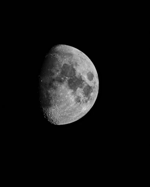 Free High-resolution black and white photograph of the moon's surface. Stock Photo