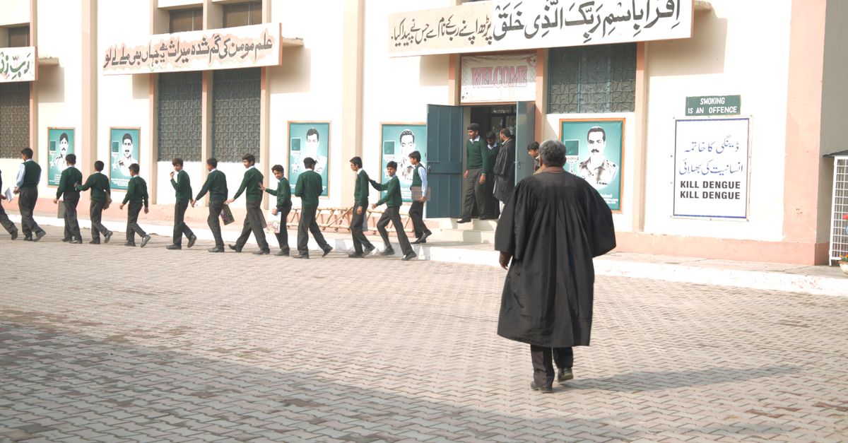 Group of Students Lined Up Outside a School Building · Free Stock Photo