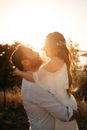 Man and Woman Kissing during Sunset