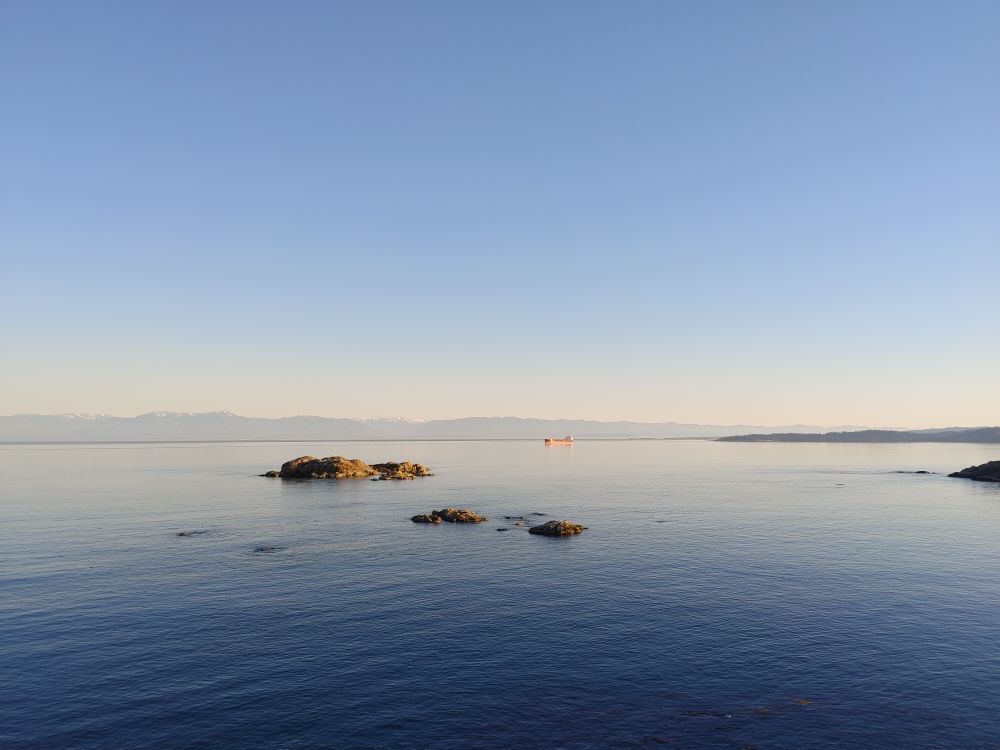 Rock Formations at Sea Under a Clear Blue Sky · Free Stock Photo
