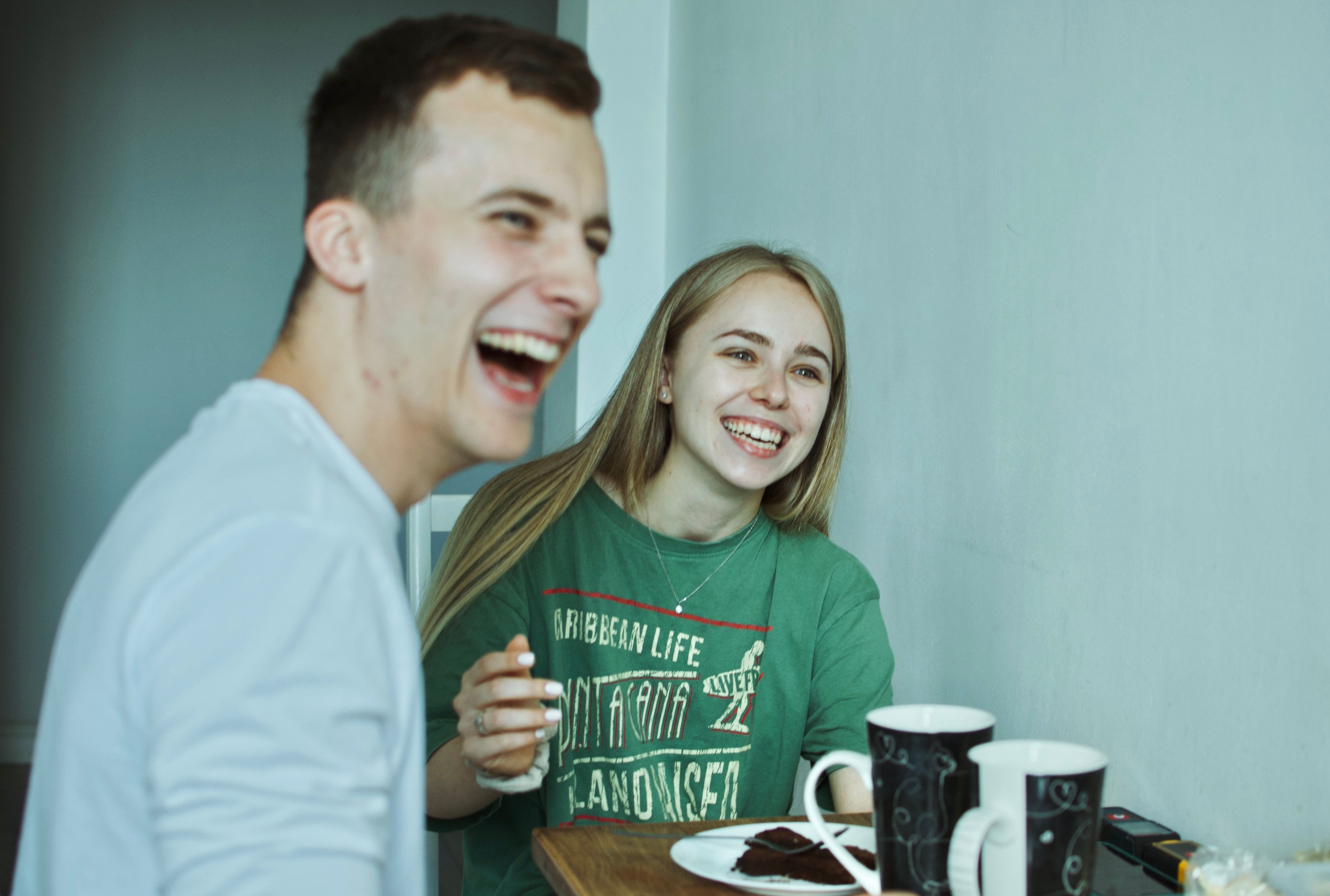 Man and Woman Laughing Together · Free Stock Photo