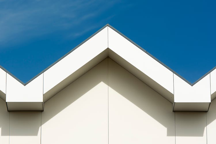 Apex Of A Roof Under A Blue Sky