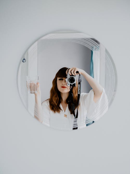 Free Woman Taking Picture in Mirror Stock Photo
