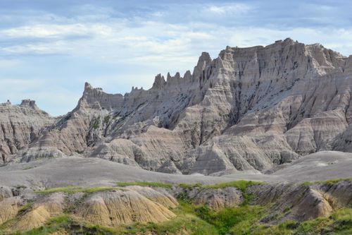 Free Stunning rock formations in Badlands National Park under a clear blue sky. Stock Photo