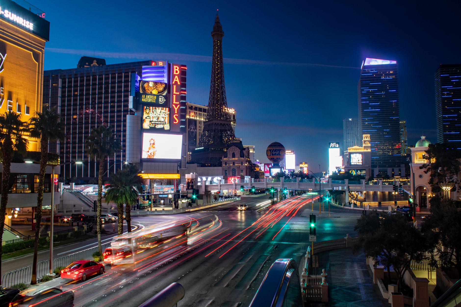 Captivating night view of Las Vegas Strip with vibrant traffic and iconic hotels. Captivating night view of Las Vegas Strip with vibrant traffic and iconic hotels.