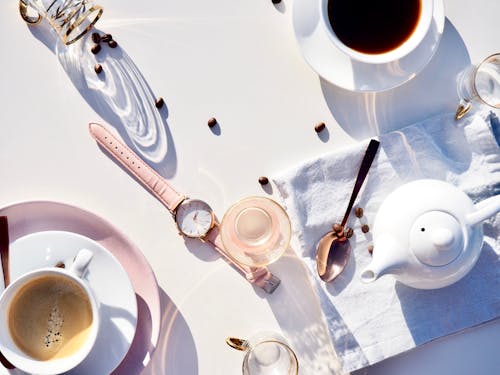 Free Spoon, Watch, Cups, and Kettle on Table Stock Photo
