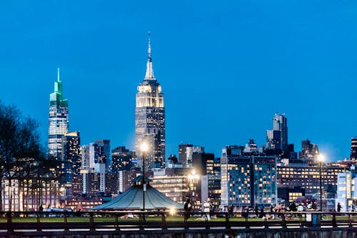 Free Manhattan Skyline with Empire State Building Under Blue Sky Stock Photo