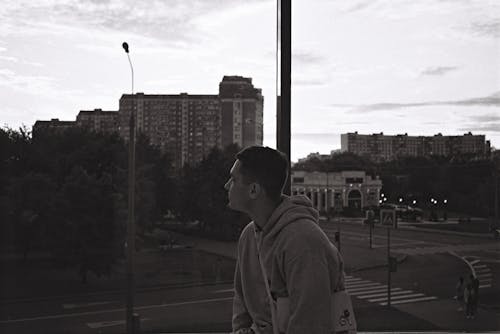 Free Street Photography of a Man in a Gray Hoodie Stock Photo