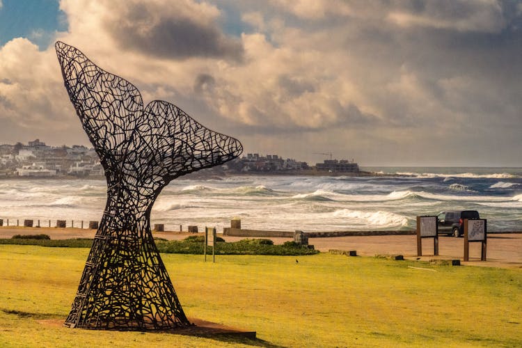 Sculpture By The Sea Under Cloudy Sky