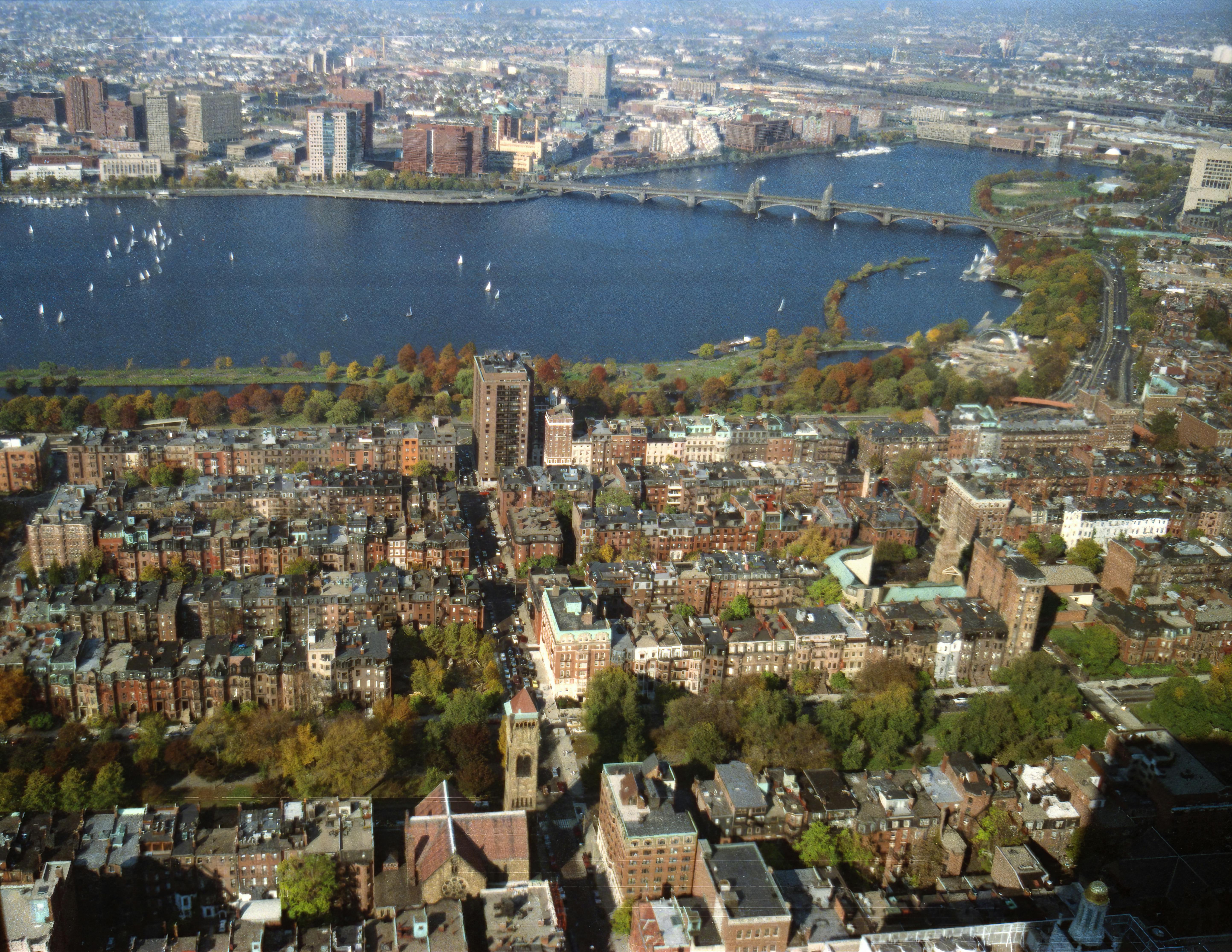 Stunning aerial shot of Boston skyline and Charles River in fall.