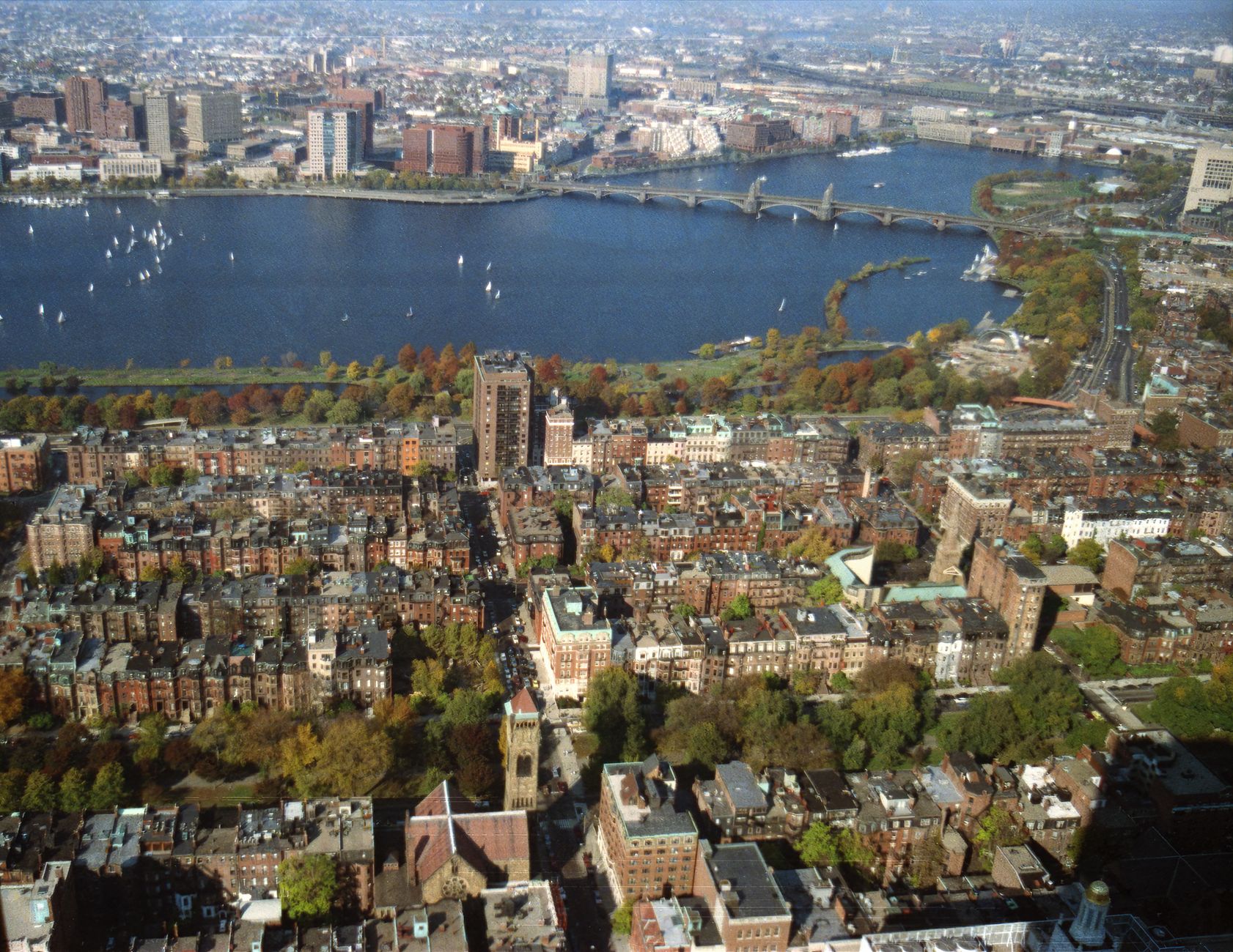 Stunning aerial shot of Boston skyline and Charles River in fall.