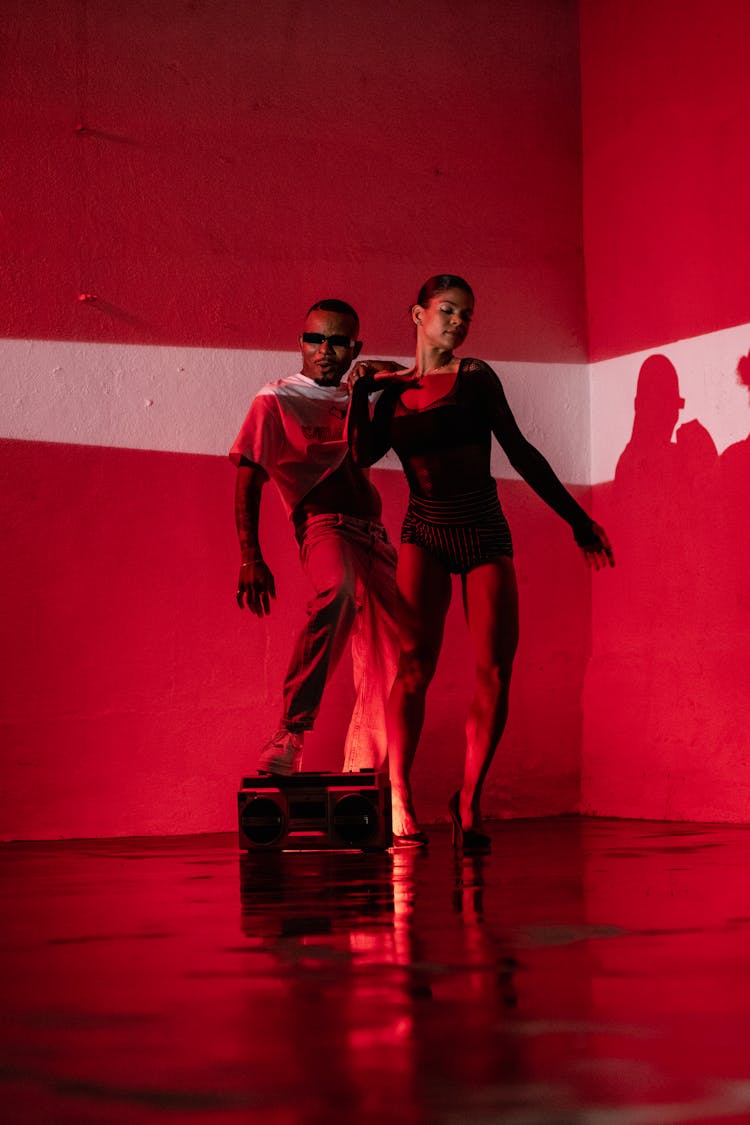 Man And Woman Posing In Red Lighting 