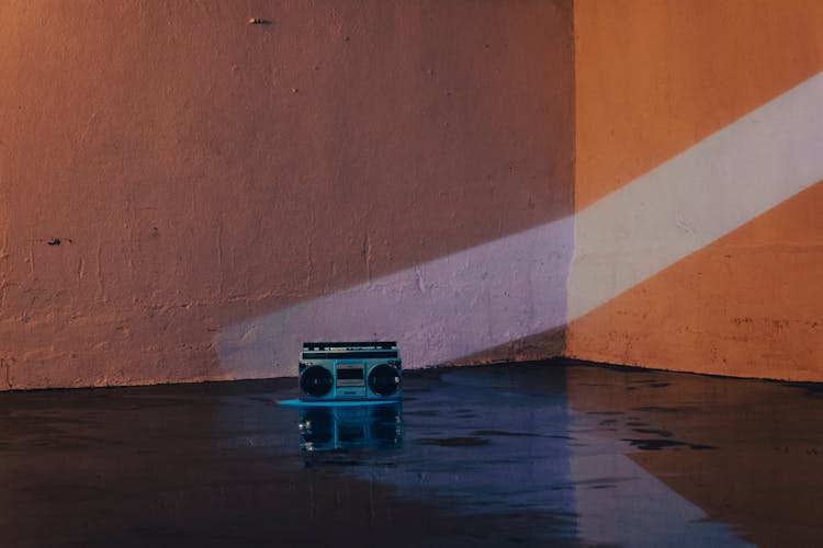 Old School Radio Standing On The Floor In An Empty Space