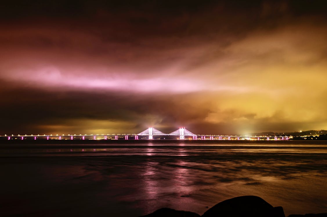 Illuminated Bridge Over Sea Bay