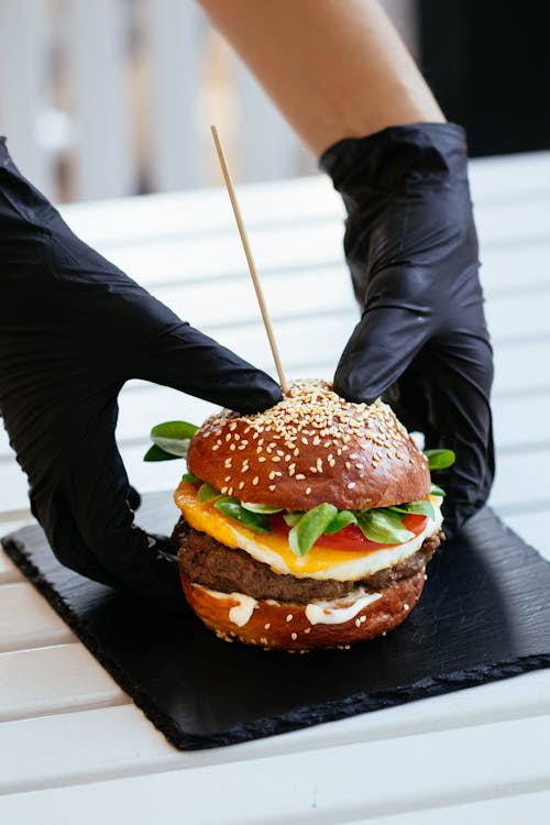 Free Selective Focus Photography of Skewed Cheeseburger Stock Photo