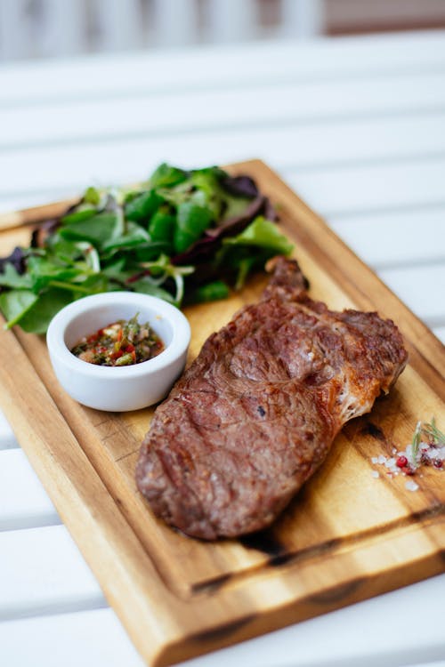 Shallow Focus Photography of Meat Dish and Leaves