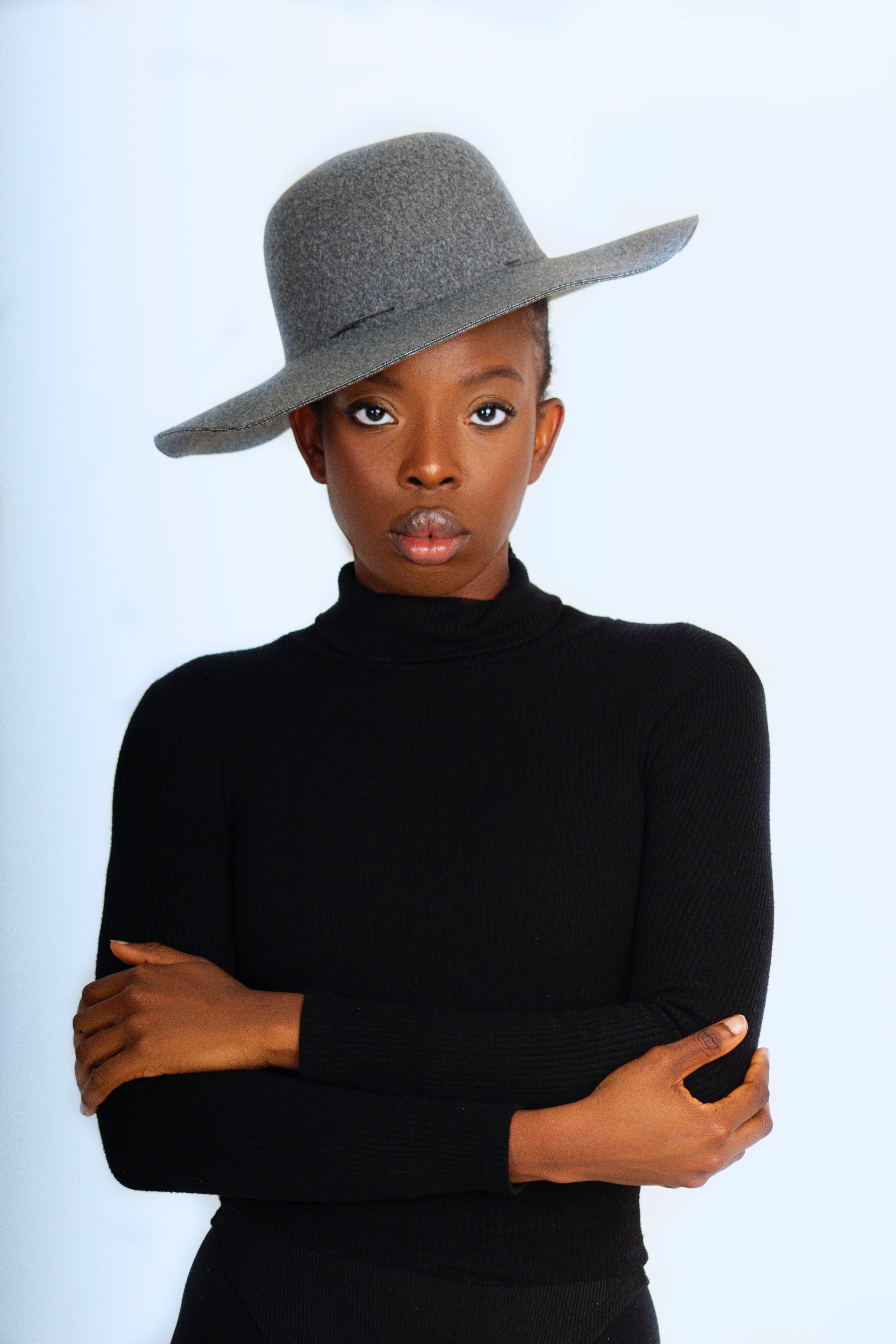 Woman in Black Long Sleeve Shirt and Black Hat · Free Stock Photo