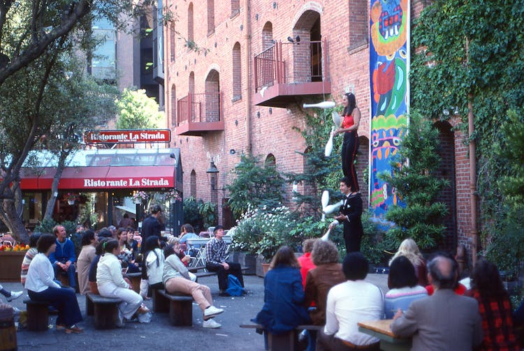 People Watching A Performance On A Street 