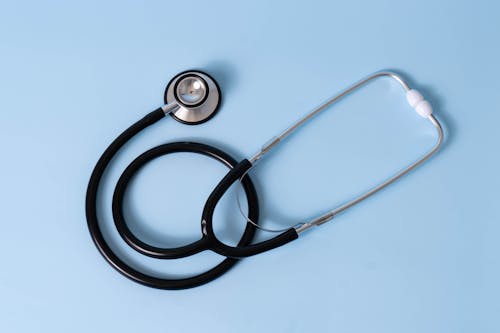 Black and Silver Stethoscope on Light Blue Background 