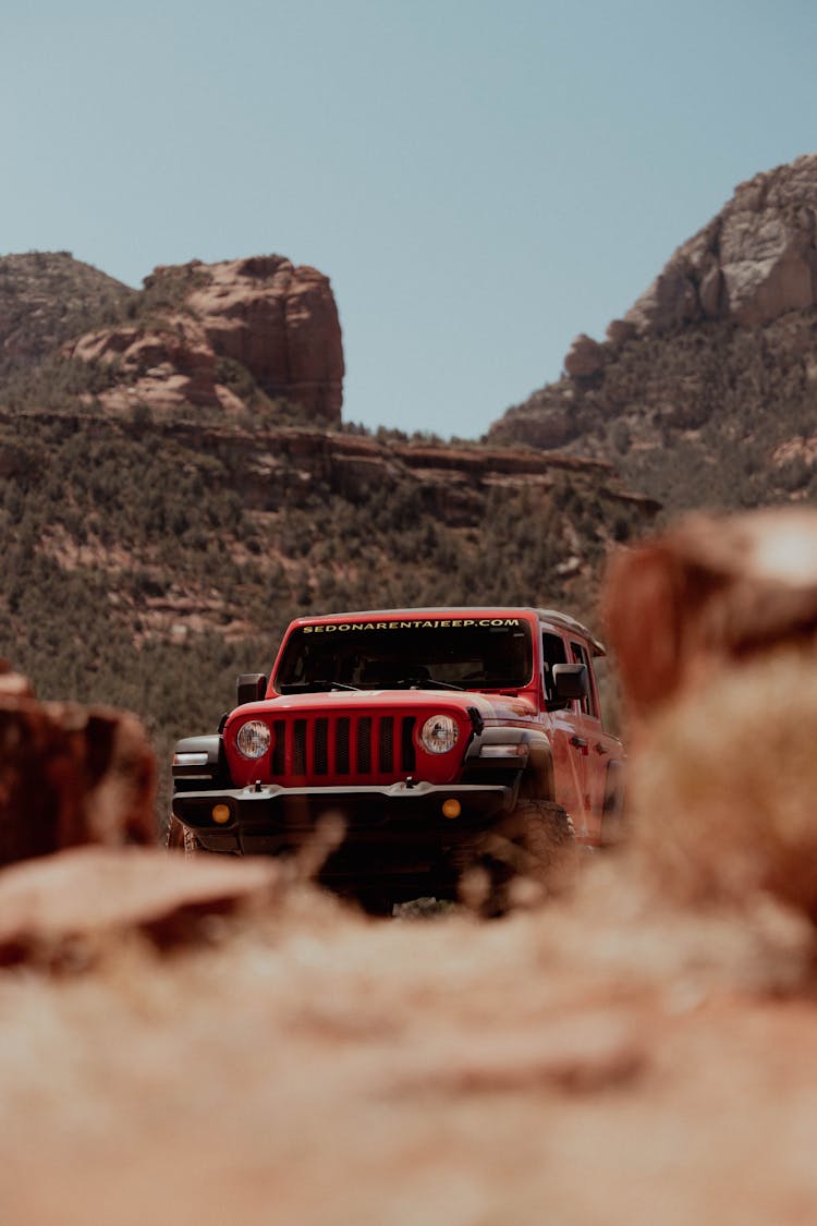 Offroad Car Standing In Remote Desert Landscape