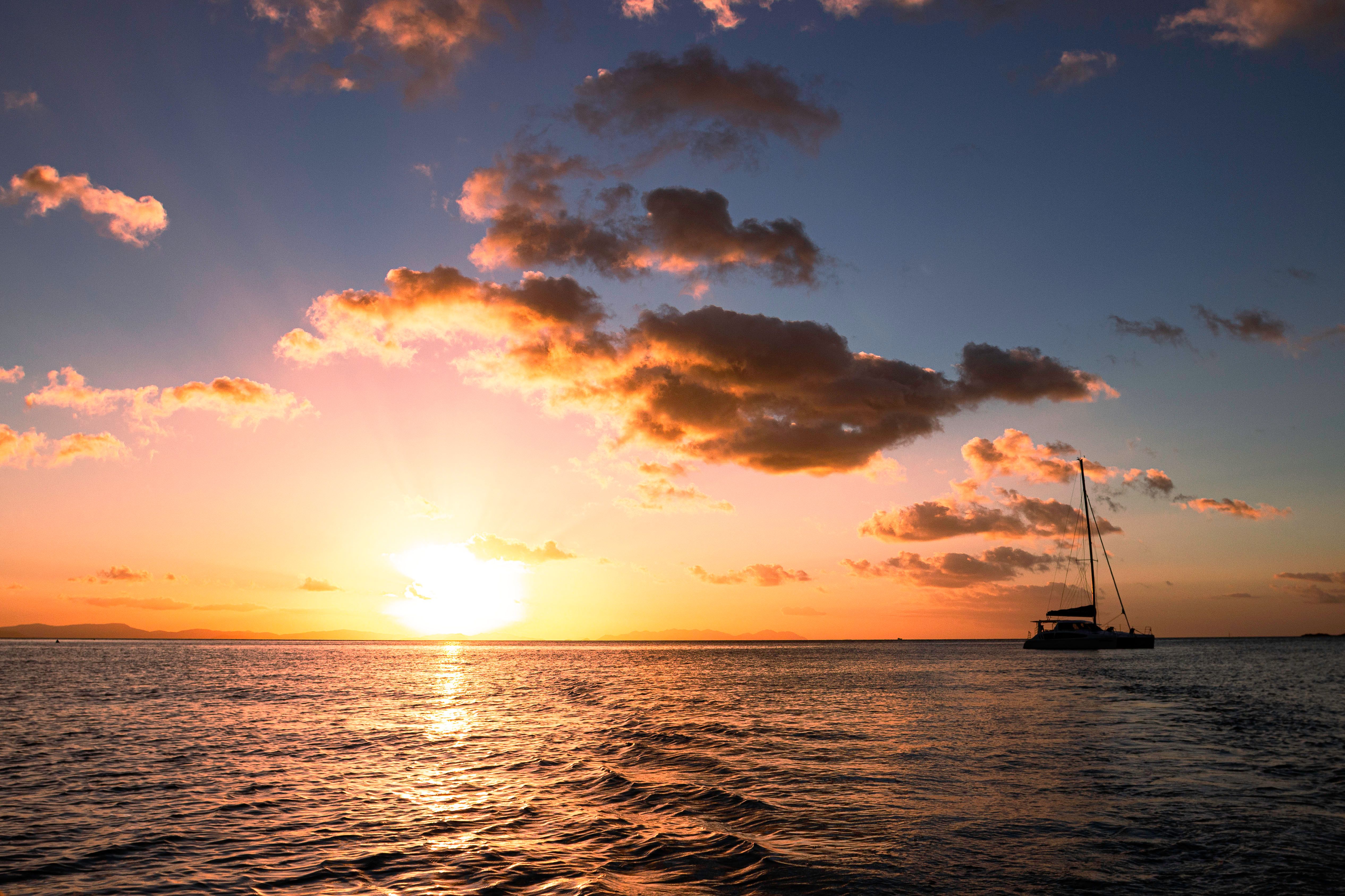 Silhouette of Boat on Sea during Sunset · Free Stock Photo
