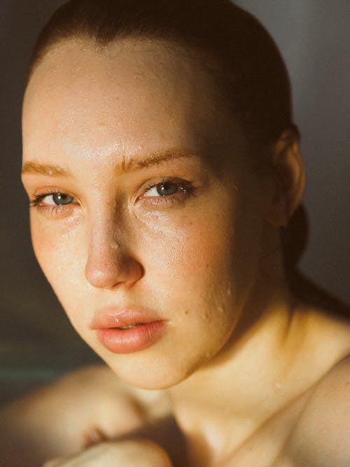 Portrait of a Woman with Wet Hair and Skin