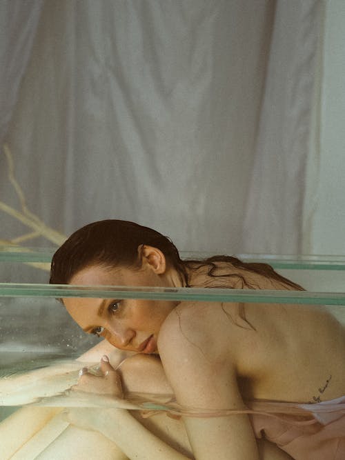 A Woman in the Clear Glass Bathtub